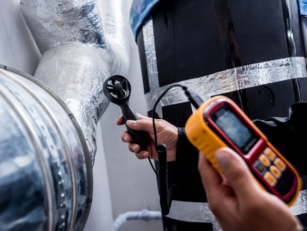 HVAC airflow testing during a home energy evaluation to improve system efficiency and indoor comfort